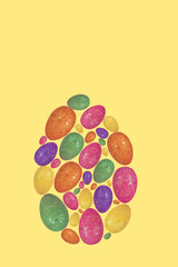 Fototapeta na wymiar Trendy Easter egg made with colorful eggs on illuminating yellow background.