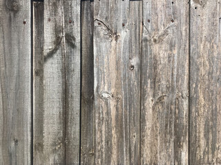 Distressed wooden fence panels close-up