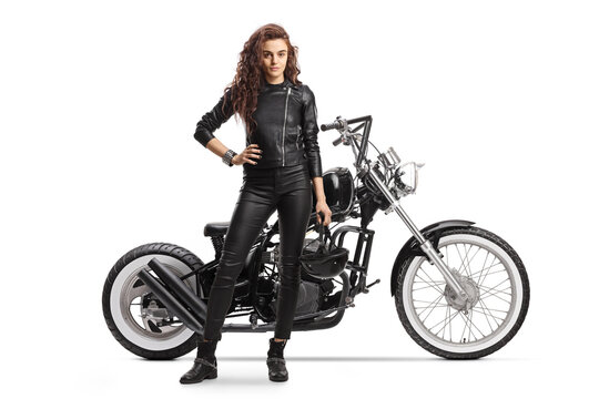 Full length portrait woman with a chopper motorbike posing