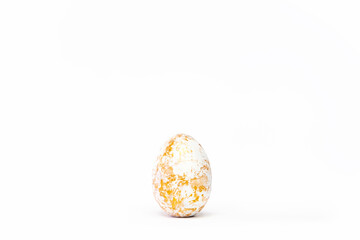 Minimal easter card. One easter trendy golden decorated egg on white background. Copy space for text.