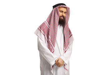 Young saudi arab man in a traditional dishdasha looking to the side