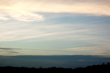 Sunset in a neighborhood of são paulo near the guarapiranga dam. The sky with a unique and differentiated color. Sky blue with white of clouds. sky concept. Nature concept.
