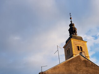 Churche tower iluminate with sun