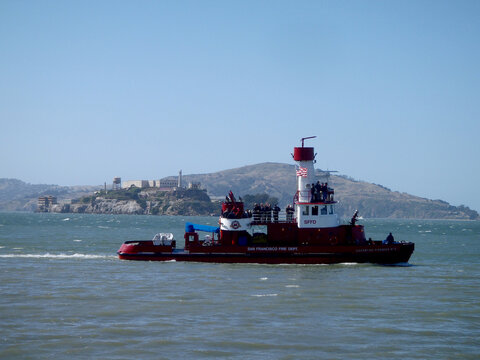 SFPD Fire Boat pass in front of Alcatraz and Angel Island in San Francisco Bay