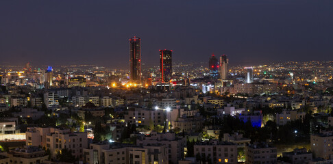 Fototapeta na wymiar Panoramic night shot of the new downtown of Amman city the capital of Jordan