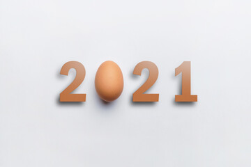 Year 2021 with an egg with top view. Happy easter concept.