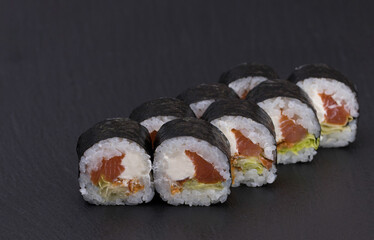 Sushi Rolls Sake Kunsei Maki with Rice, SMOKED SALMON, CREAM CHEESE, Iceberg salad and crispy onions