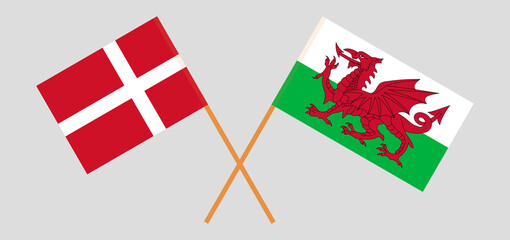 Crossed flags of Denmark and Wales. Official colors. Correct proportion