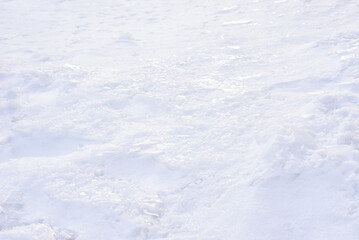 Snow crust - a layer of ice over a layer of snow. Texture, pattern, winter background.