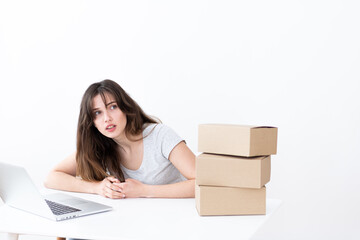 The girl places an order for the delivery of parcels, the concept of online delivery.