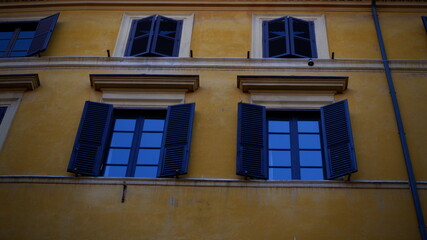 Fototapeta premium Venice Italy - Beautiful Pink wall with two blue windows