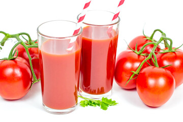 Fresh homemade tomato juice in the glasses on white background.