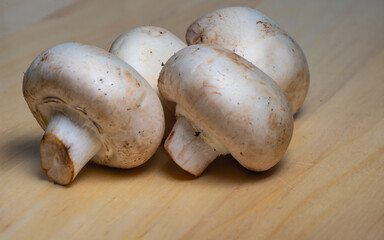 chopped mushrooms champignons on a wooden board, ready to eat