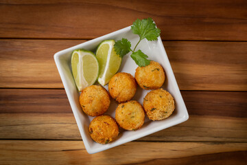 Cod dumpling. Traditional brasilian snack. Bunuelos de bacalão.