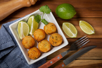 Cod dumpling. Traditional brasilian snack. Bunuelos de bacalão.