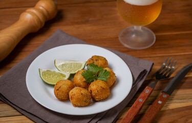 Cod dumpling. Traditional brasilian snack. Bunuelos de bacalão.