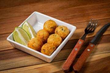 Cod dumpling. Traditional brasilian snack. Bunuelos de bacalão.