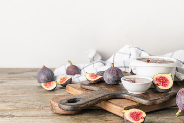 Bowls of sweet fig jam on wooden table