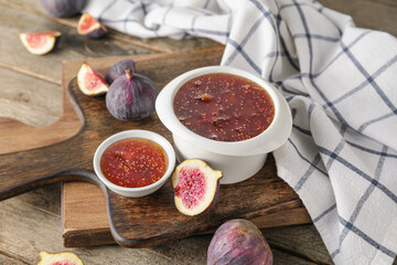 Bowls of sweet fig jam on wooden table