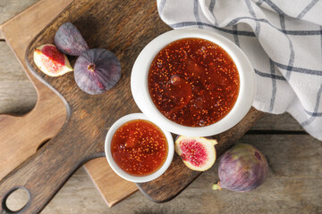 Bowls of sweet fig jam on wooden table