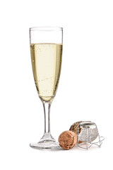Glass of champagne and cork on white background