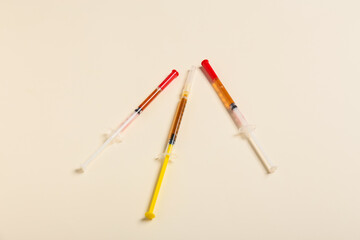 Syringes on light background