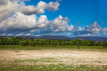 Fototapeta premium Landscape with sky and clouds and mountains background. View of Serra de Aire, Portugal from the park of Olhos de Água
