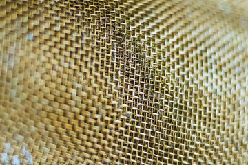 Brass wire mesh background, selective focuse - 421137533