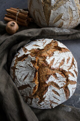 Sourdough bread texture close up. Crusty bread with beautiful pattern on the top. Healthy eating concept. 