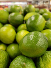 Limes in supermarket produce area