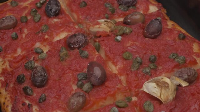 Pizza Sardenaira typical Italian food, Sardinara Liguria traditional gourmet, olives, tomato, garlic handmade ligurian Mediterranean gourmet