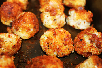 Closeup of potato croquettes on a baking sheet