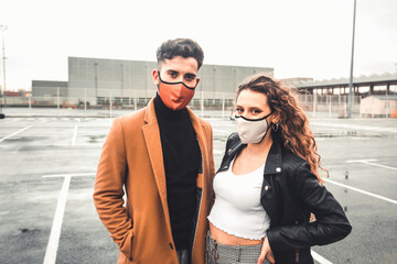 A couple posing at the street with casual clothes