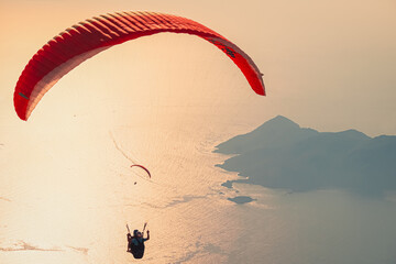 Paraglider flying on Oludeniz beach in Fethiye, Mugla, Travel destination. Summer and holiday...