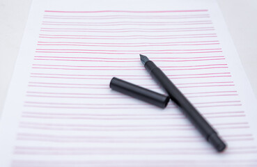 Stationery and a black pen