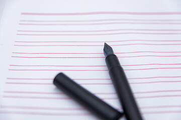 Stationery and a black pen