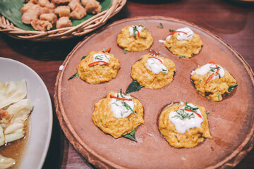 Ho mok with crab. Clay portion of Mini Thai spicy steamed crab curry paste serve on hollow mortar pan