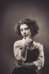 Vintage portrait of a young girl with curly hair