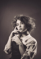 Vintage portrait of a young girl with curly hair