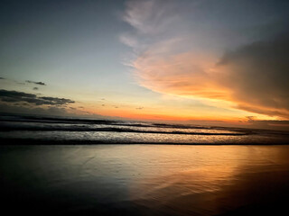 colorful clouds for a beautiful sunset on a paradise beach