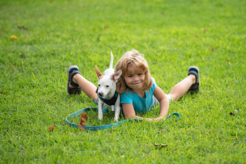 Child with dog. Kid with puppy. Doggy lover.