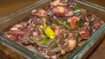 Indonesian traditional dishes, seafood spicy calamari served in the glass bowl