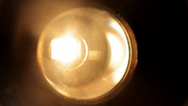 Lens of an old movie projector in close up view - macro shot