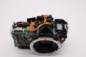Bangkok, Thailand 10 Mar 2021 DSLR or Mirrorless Camera System Digital camera repair The camera is disassembled, white background.