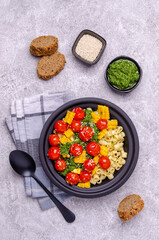 Pasta with vegetables and green sauce