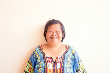 smiling asian down syndrome woman.Adult down syndrome.mentally disabled woman.Therapy mental health.Happy woman mother.Disability person.caregiver, Senior woman portrait.health, care, medical work. © MIA Studio