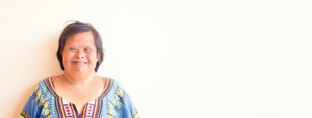 smiling asian down syndrome woman.Adult down syndrome.mentally disabled woman.Therapy mental health.Happy woman mother.Disability person.caregiver, Senior woman portrait.health, care, medical work. © MIA Studio