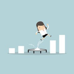 Businesswoman jumping from trampoline back to top of growing bar graph.