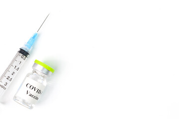 Covid-19 bottle vaccination and syringe over white background