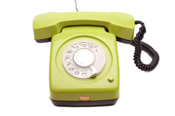 Green telephone retro style on white background. Vintage phone handset receiver